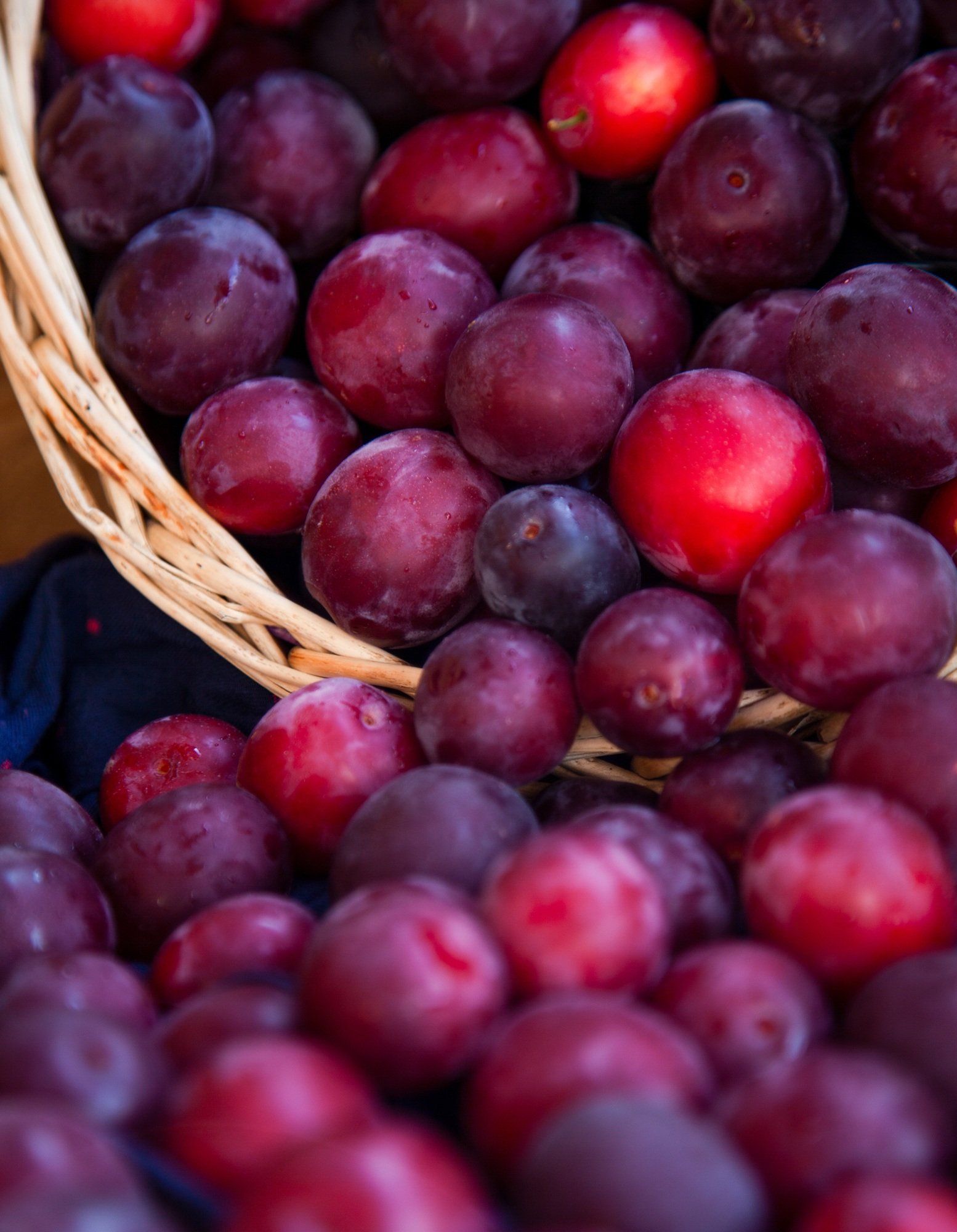 Plum harvest in a basket. summer fruit plums